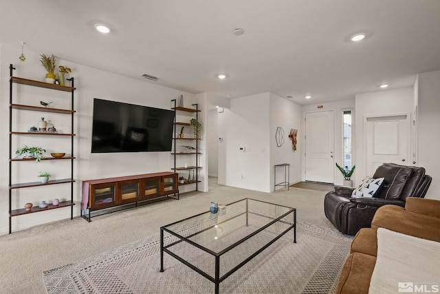 carpeted living room featuring visible vents and recessed lighting