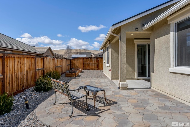 view of patio featuring outdoor dining space and a fenced backyard