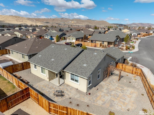 birds eye view of property with a residential view and a mountain view