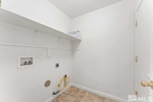 washroom featuring hookup for a gas dryer, laundry area, washer hookup, baseboards, and electric dryer hookup