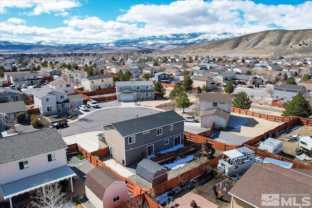 drone / aerial view featuring a mountain view and a residential view