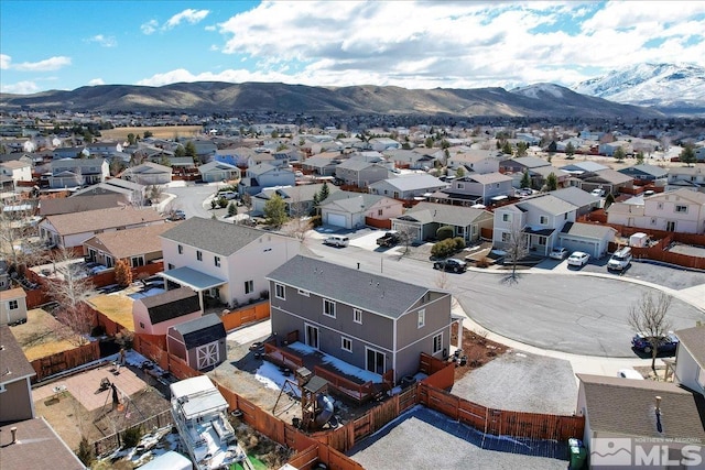 birds eye view of property with a residential view and a mountain view