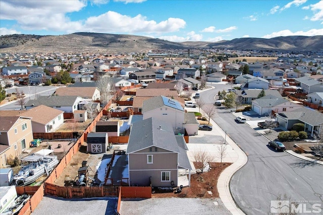 drone / aerial view with a residential view and a mountain view