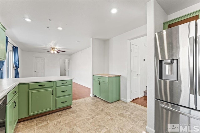 kitchen featuring dishwasher, stainless steel fridge, light countertops, and green cabinetry