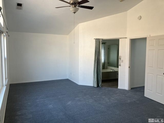 unfurnished bedroom featuring vaulted ceiling, carpet flooring, visible vents, and baseboards