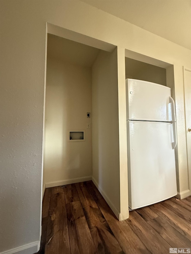 hallway with wood finished floors and baseboards