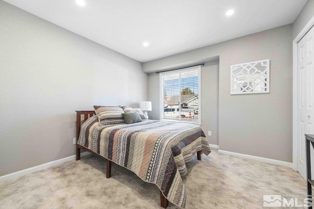 carpeted bedroom with recessed lighting and baseboards