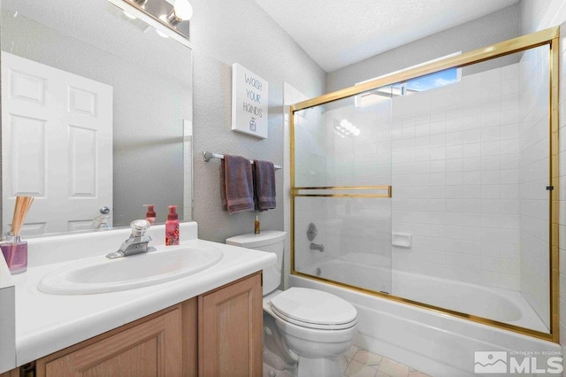 full bathroom featuring a textured wall, toilet, enclosed tub / shower combo, vanity, and a textured ceiling