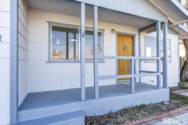 doorway to property with covered porch