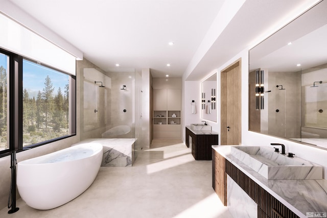 full bath with a soaking tub, a walk in shower, two vanities, and recessed lighting