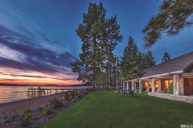 yard at dusk with a water view