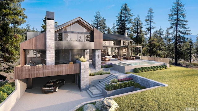 rear view of property with outdoor lounge area, a yard, a balcony, and a patio