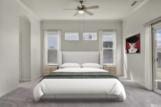 bedroom featuring light carpet, visible vents, crown molding, and baseboards