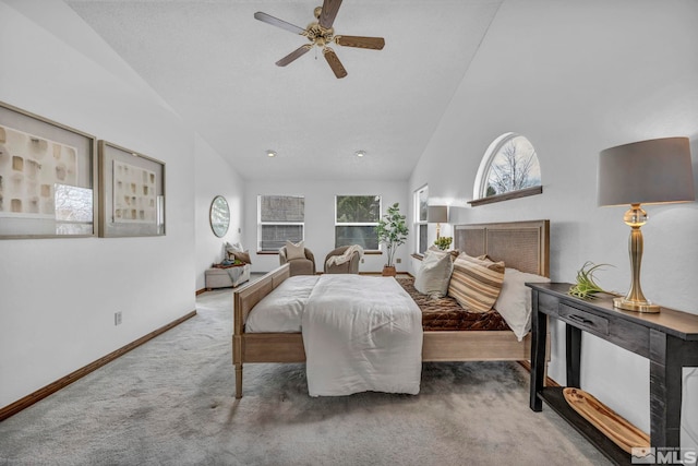 bedroom featuring high vaulted ceiling, a ceiling fan, baseboards, and carpet floors