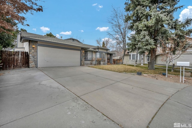 ranch-style house with stone siding, an attached garage, a front lawn, and fence