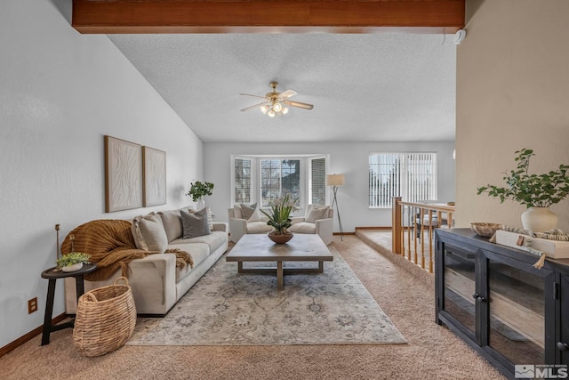 living room featuring carpet flooring, baseboards, vaulted ceiling with beams, and a textured ceiling