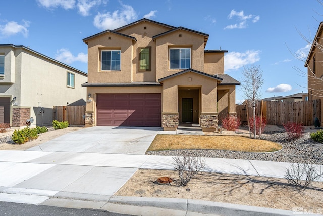 view of front of property with fence, stucco siding, concrete driveway, a garage, and stone siding