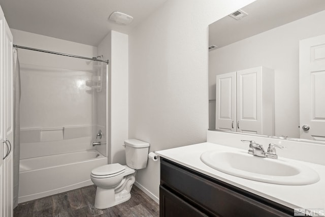 full bathroom featuring visible vents, toilet, shower / bathtub combination, wood finished floors, and vanity