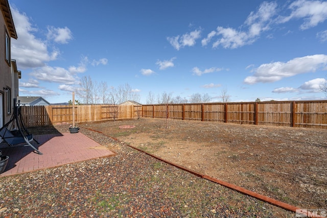 view of yard with a fenced backyard and a patio area