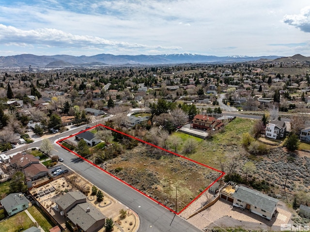 birds eye view of property featuring a mountain view and a residential view