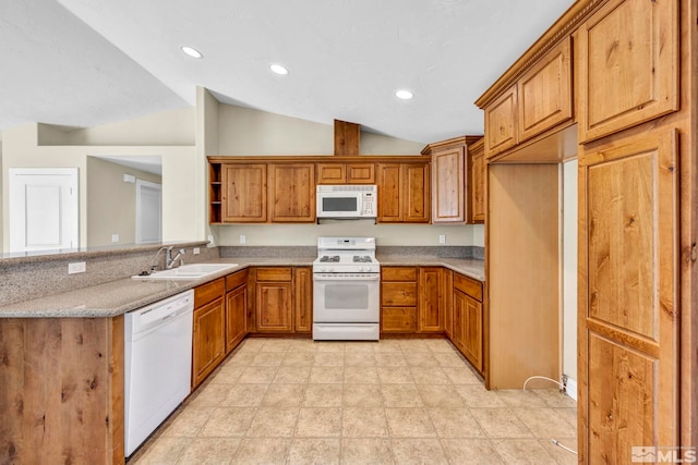 kitchen with a sink, white appliances, brown cabinetry, and vaulted ceiling