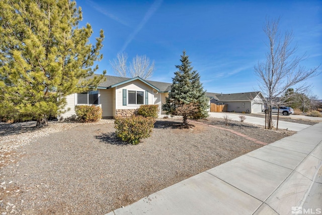 ranch-style house with stone siding