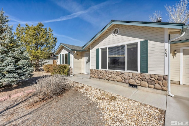 view of front of home featuring stone siding