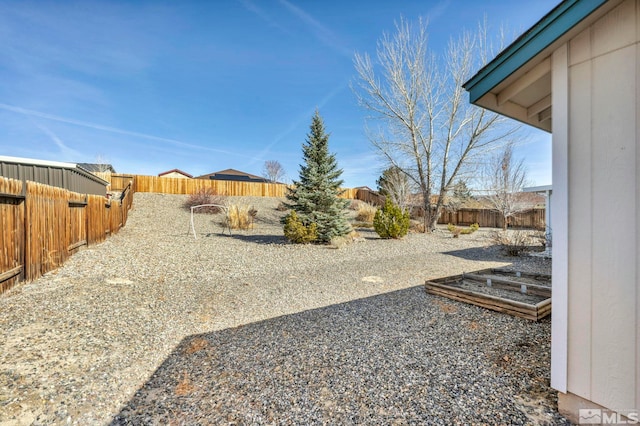 view of yard featuring a fenced backyard