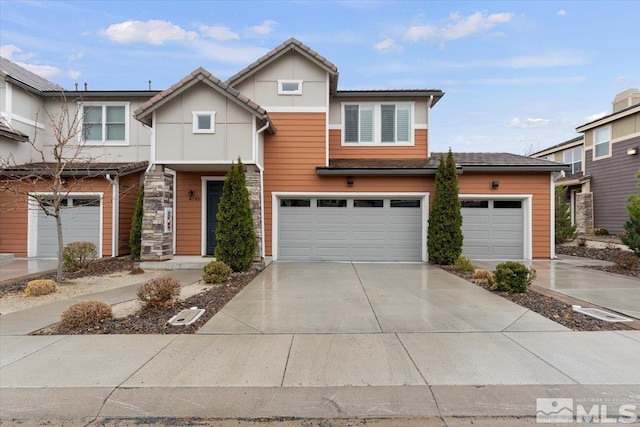 view of front of home with driveway and an attached garage