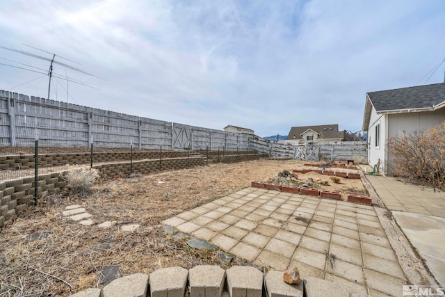 view of yard featuring a patio and a fenced backyard