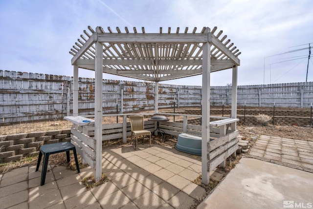 view of patio / terrace with a fenced backyard and a pergola