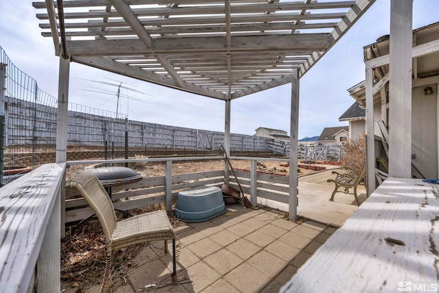 view of patio / terrace with a fenced backyard and a pergola