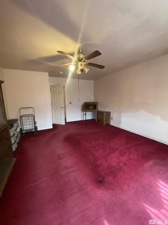 bonus room with carpet flooring and ceiling fan