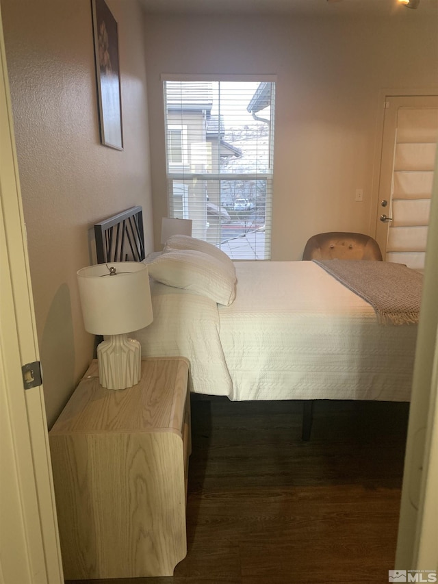 bedroom with wood finished floors