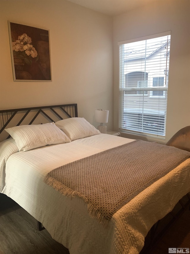 bedroom with wood finished floors