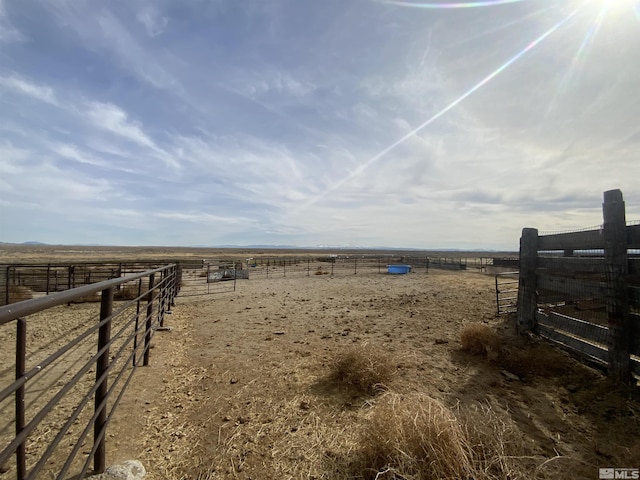 view of yard with a rural view