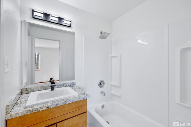 bathroom with vanity and bathing tub / shower combination