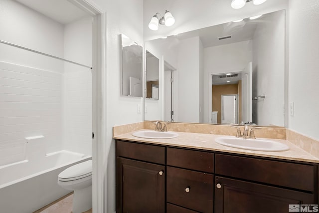 full bath with double vanity, toilet, visible vents, and a sink