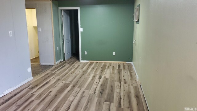 unfurnished bedroom featuring baseboards and light wood-style floors