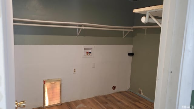 laundry area with wood finished floors, hookup for a washing machine, and laundry area