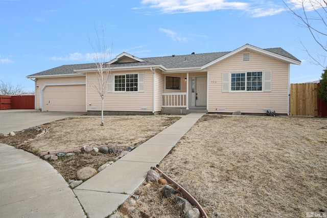 ranch-style house with concrete driveway, an attached garage, fence, and roof with shingles