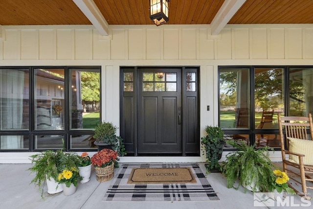 entrance to property featuring board and batten siding