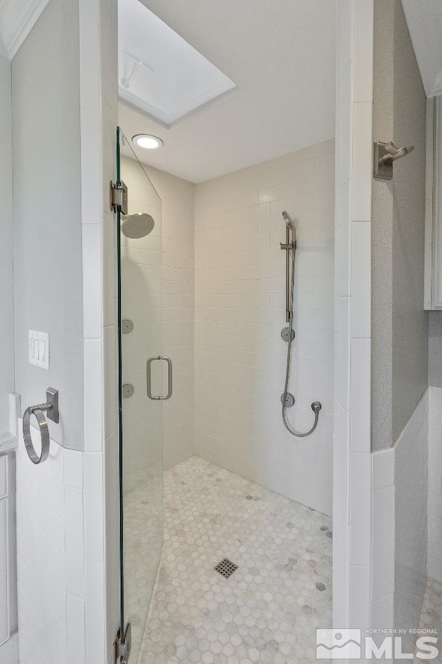 bathroom with a shower stall