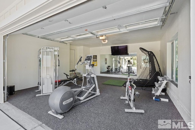 workout area with a garage