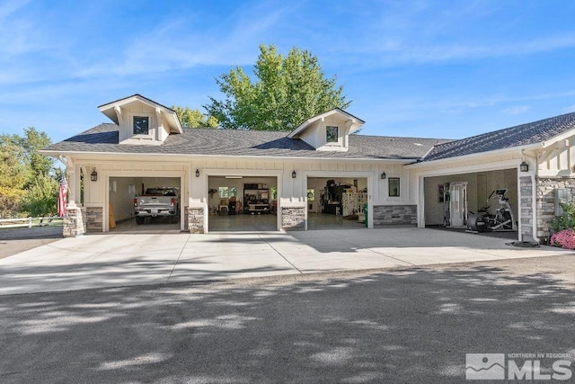 view of property with concrete driveway and a garage