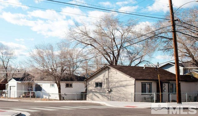 view of home's exterior with a fenced front yard