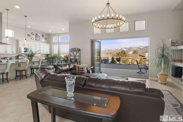 living room with light tile patterned floors and recessed lighting