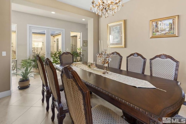 dining room featuring baseboards, a chandelier, light tile patterned floors, recessed lighting, and french doors