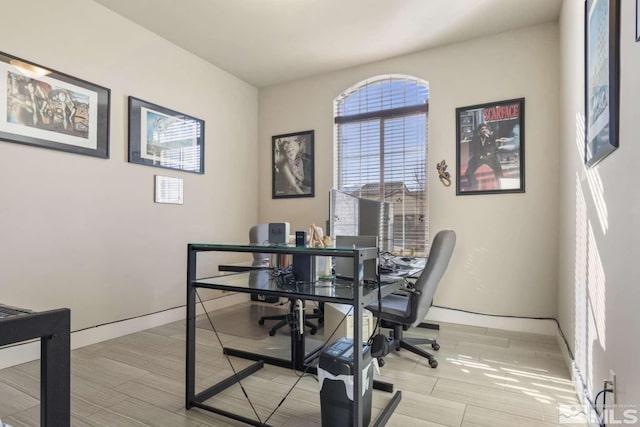 office with light wood-style floors and baseboards