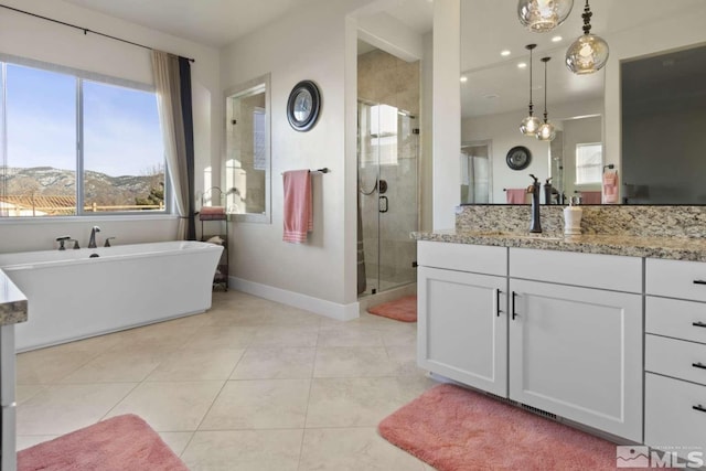 full bath with tile patterned flooring, a shower stall, baseboards, and a healthy amount of sunlight